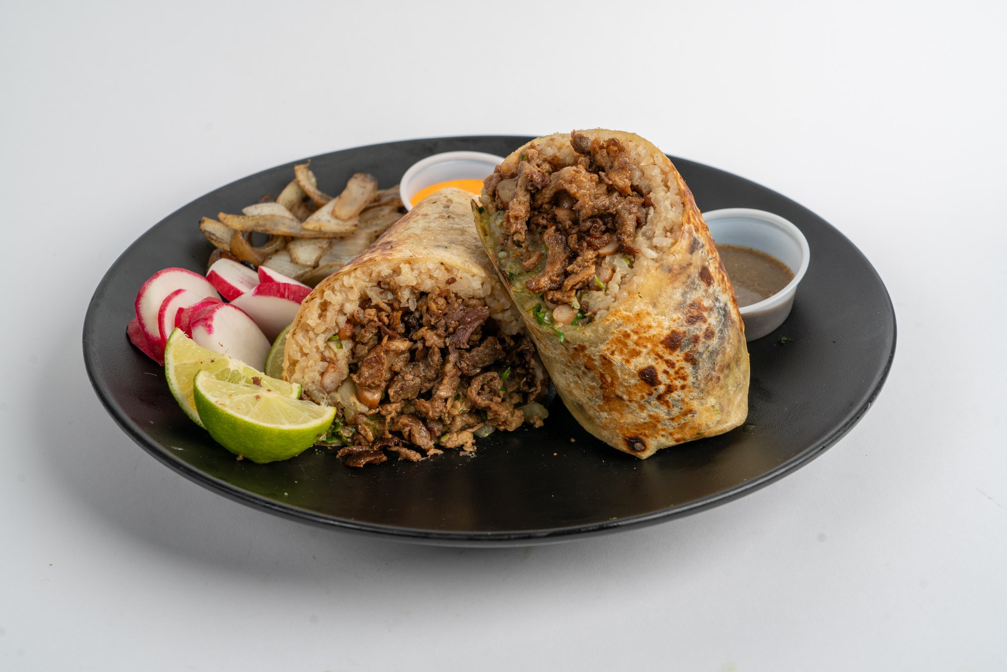 Large Mexican burrito with rice beans and meat at Mi Ranchito