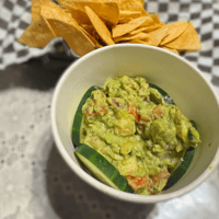 Fresh homemade guacamole with crispy tortilla chips
