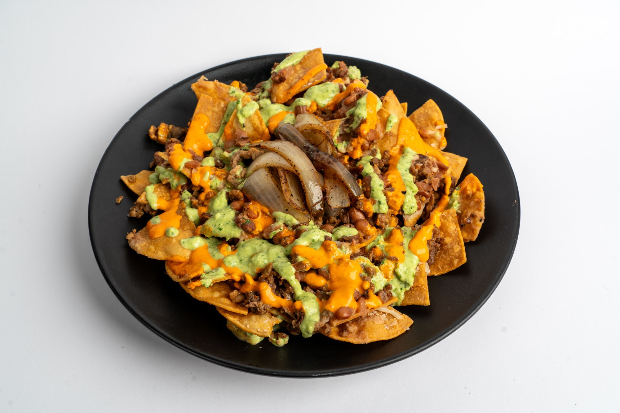 Loaded nachos with Monterey Jack cheese beans and fresh toppings